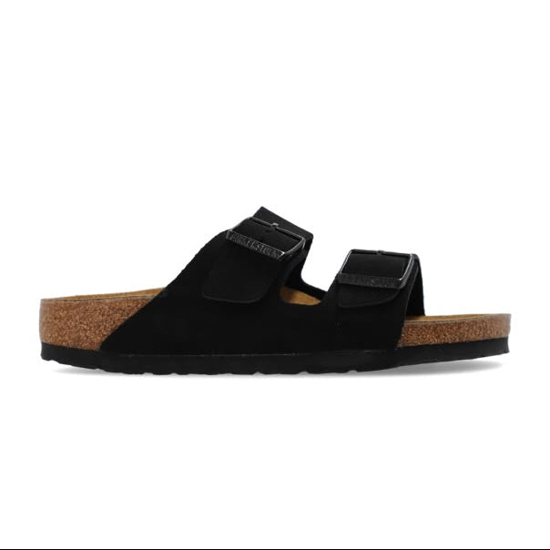 Black sandal with cork sole on a white background