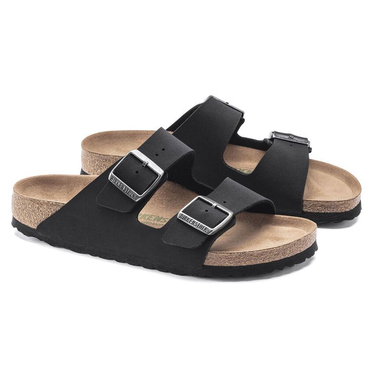 Black sandals with cork soles on a white background